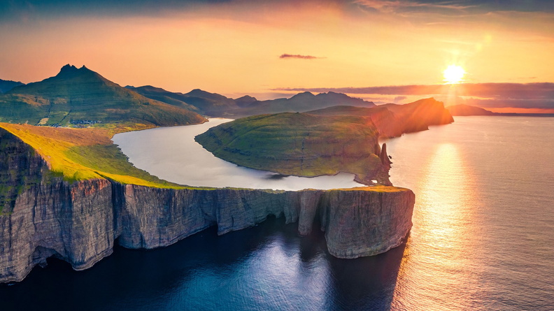 Sunset over sea + coastal waterway, Faroe Islands, Denmark